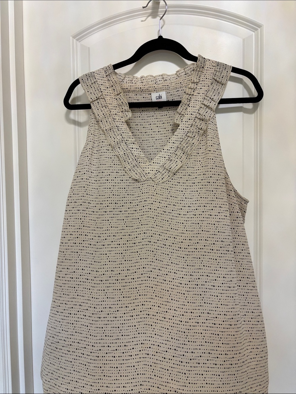 CAbi Morse code top.Cream Sleeveless V-Neck Ruffle Trim Top with Black Dot Print